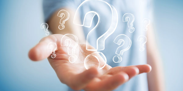 A yellow old fashioned dial telephone